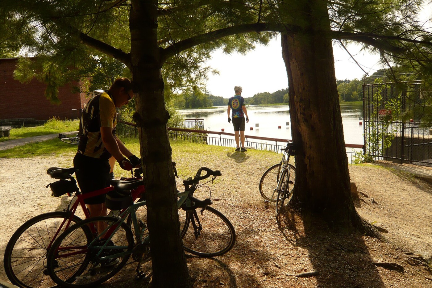 Cyclists paused beside the water at Mine Falls Park in Nashua